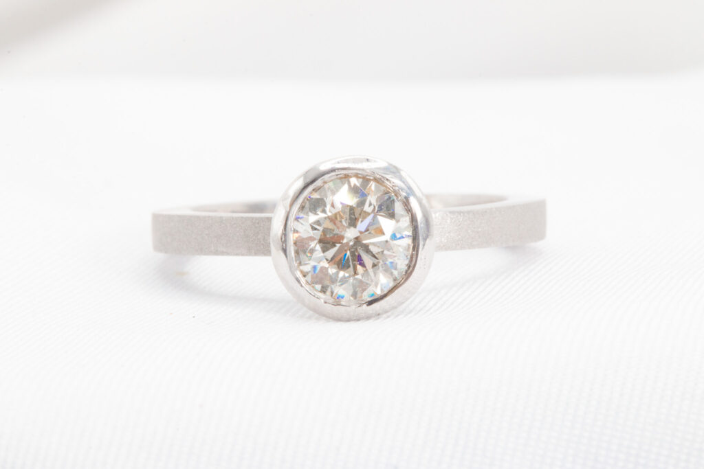 round cut bezel set diamond ring