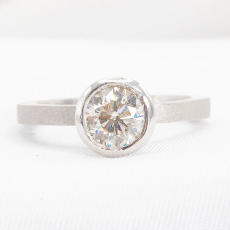 round cut bezel set diamond ring