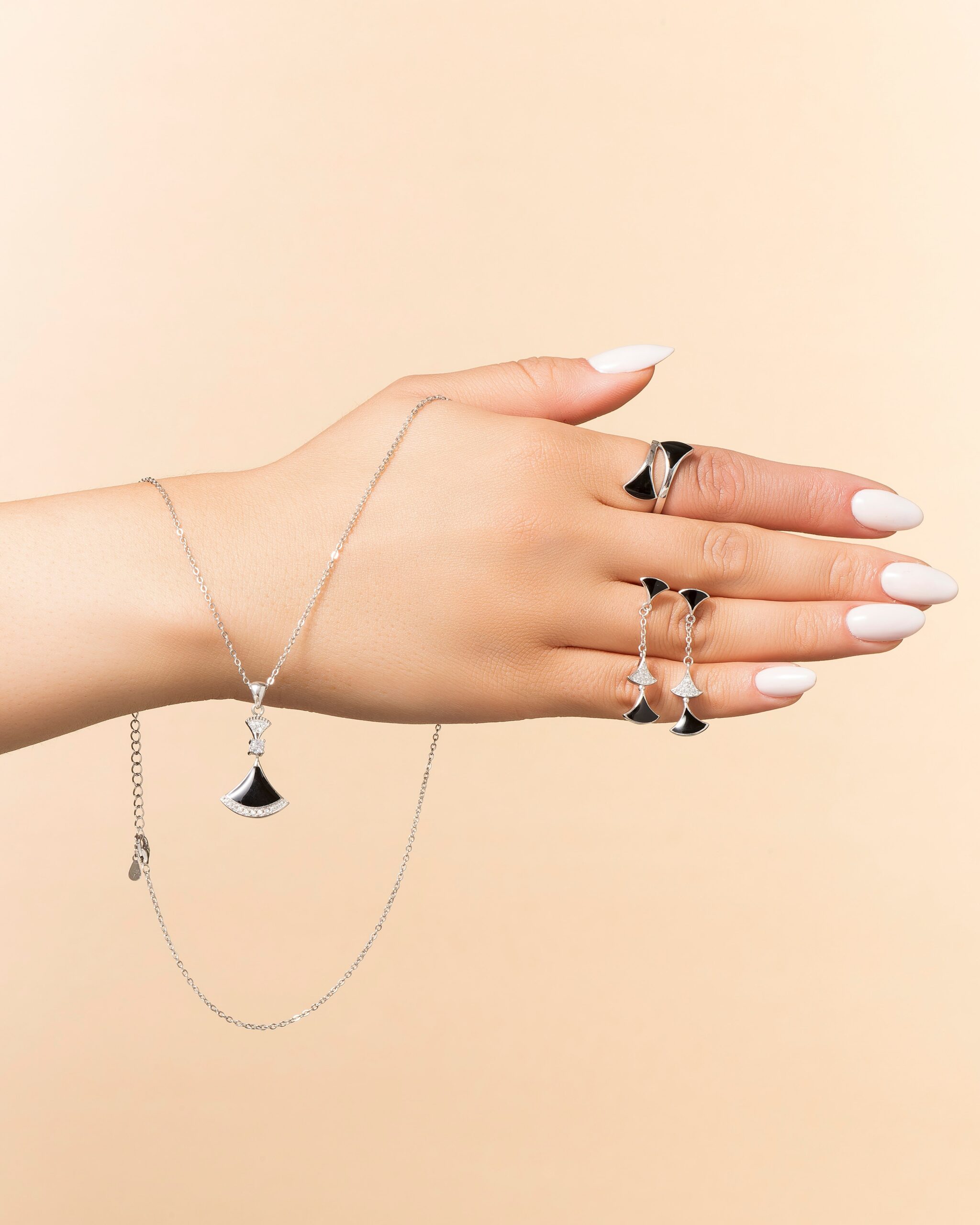 Elegant onyx jewelry set including ring, bracelet, and necklace